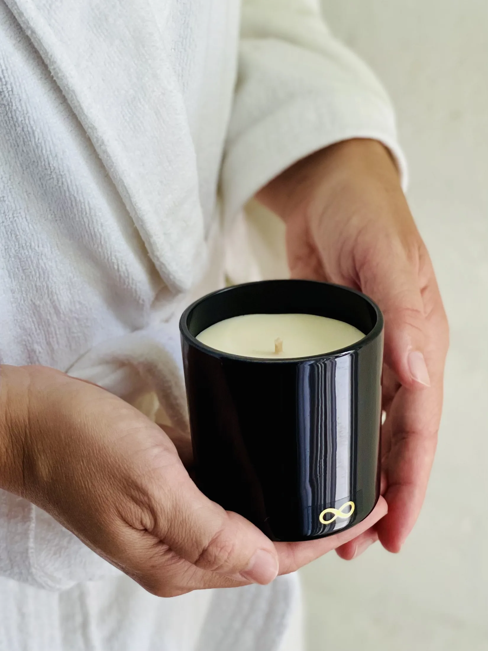 Voyde Love botanical candle in hand